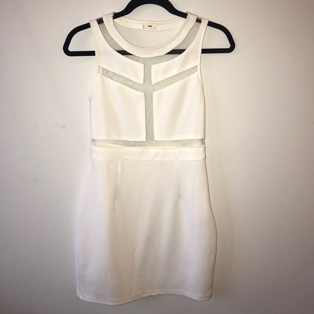 Tight white dress with sheer open back